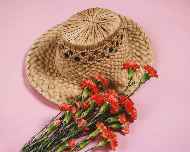 Vintage hat with carnation bouquet of flowers
