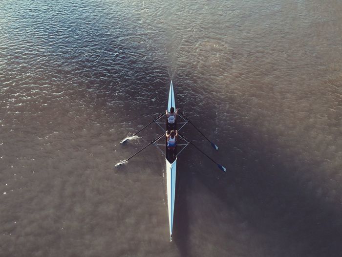High angle view of two people kayaking in sea