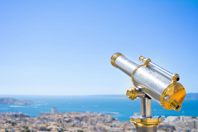 Close-up of coin-operated binoculars against clear sky