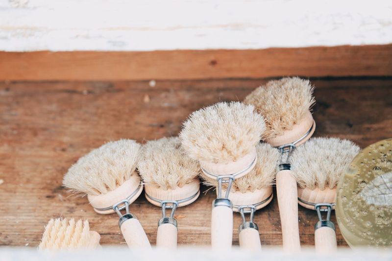 High angle view of dish brushes made of natural material on table