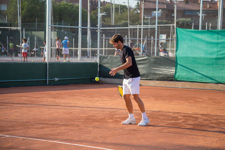 Full length of man playing with ball