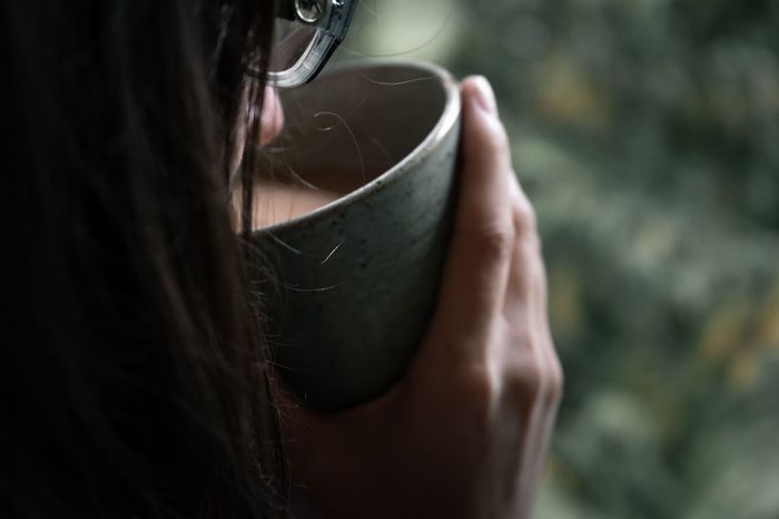 Close-up of woman drinking tea