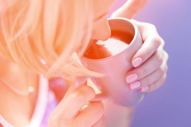 Close-up of woman drinking coffee