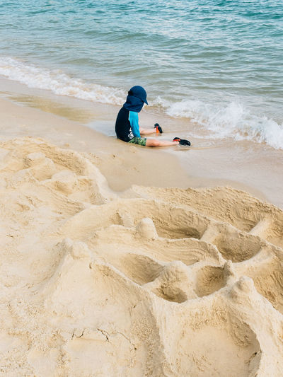 High angle view of boy on beach