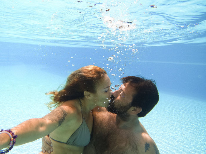 Couple embracing in swimming pool