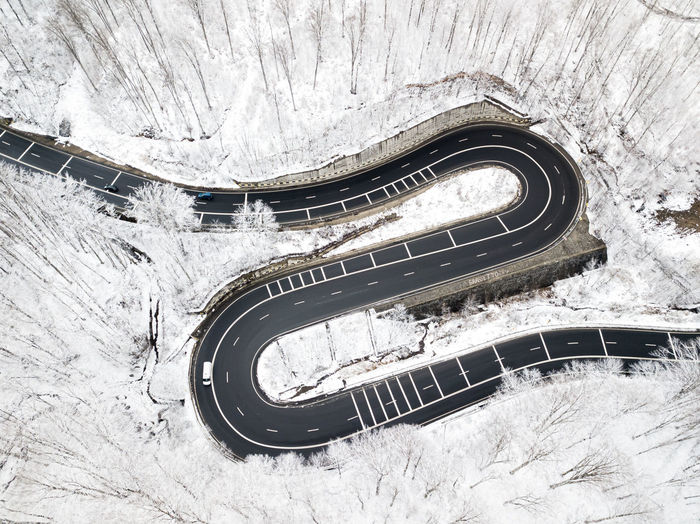 High angle view of snow covered road in tunnel