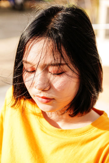 Close-up of woman in sunny day