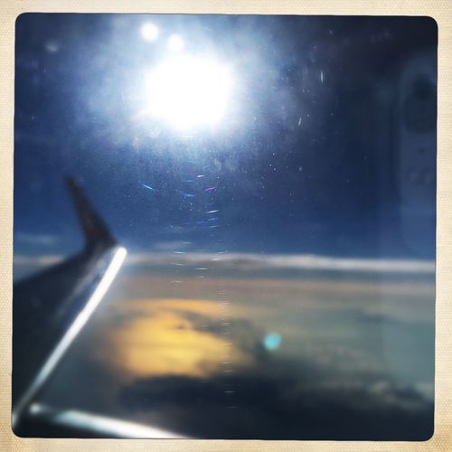 Bright sun seen through airplane