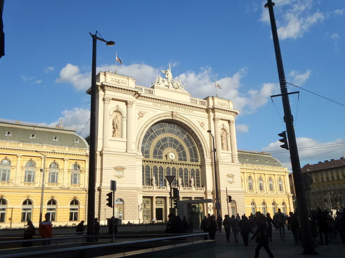 People at budapest keleti railway station against sky