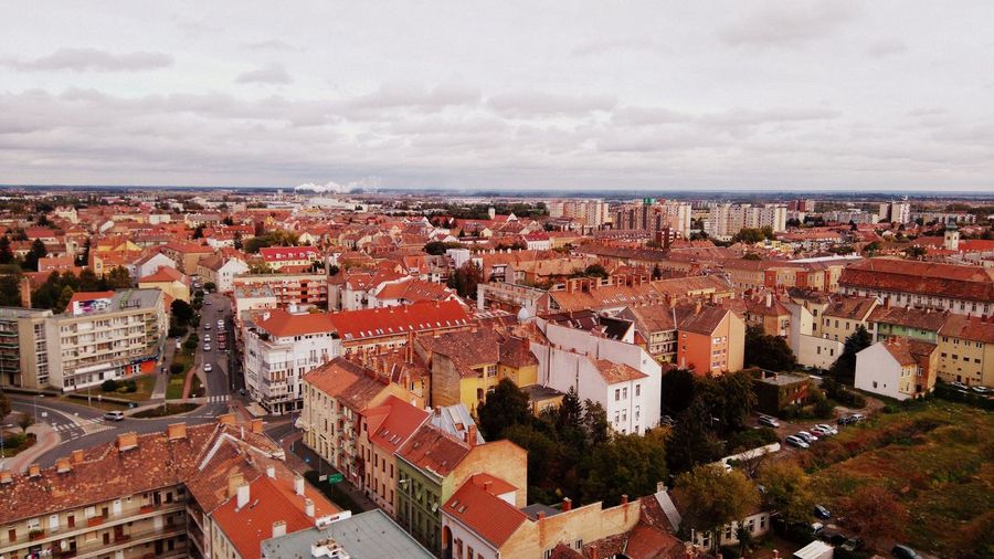 High angle view of townscape against cloudy sky