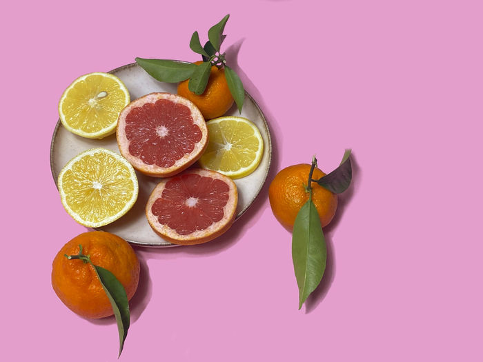 Close-up of fruits against white background