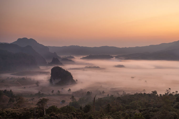 Scenic view of mountains against sky during sunset