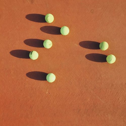 High angle view of tennis balls on field