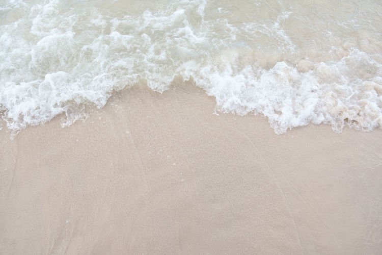 High angle view of surf on beach