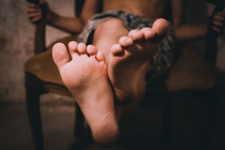 Low section of boy's feet