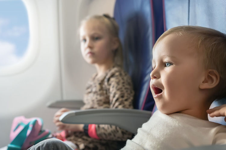 Portrait of cute boy in airplane