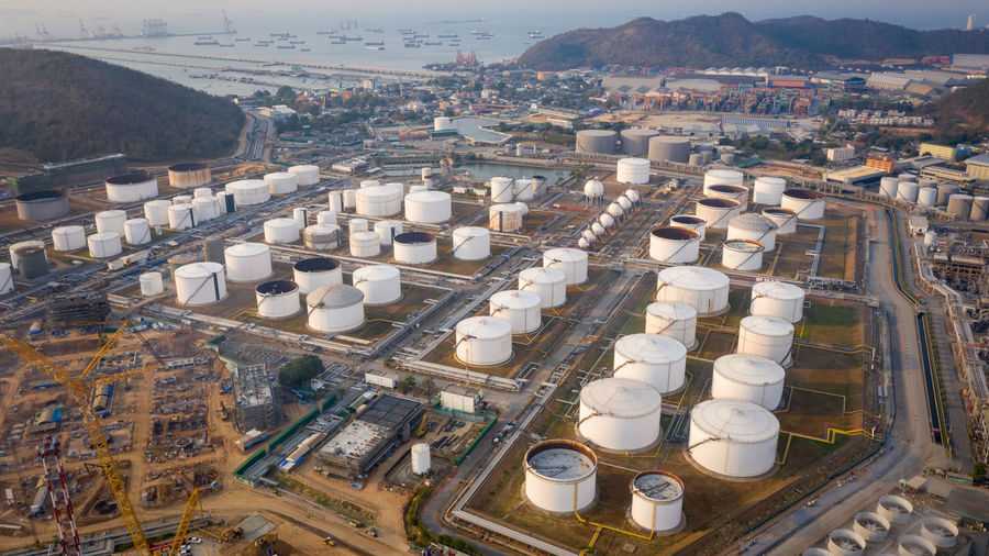Aerial view of industrial and petrochemical oil refinery oil and gas tanks with pipelines 