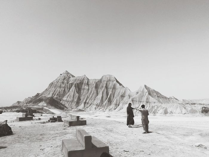 People standing at desert