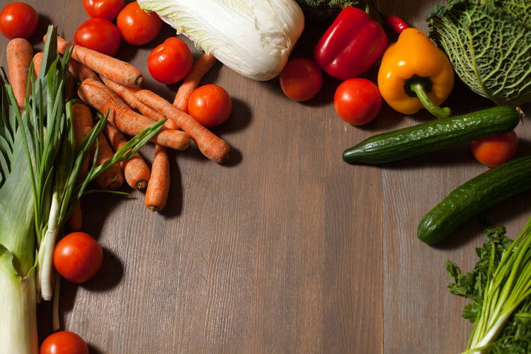 High angle view of vegetables on wooden table