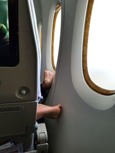 Low section of person in airplane