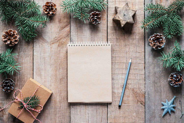 Zero waste christmas background with notebook and pencil for new year resolutions
