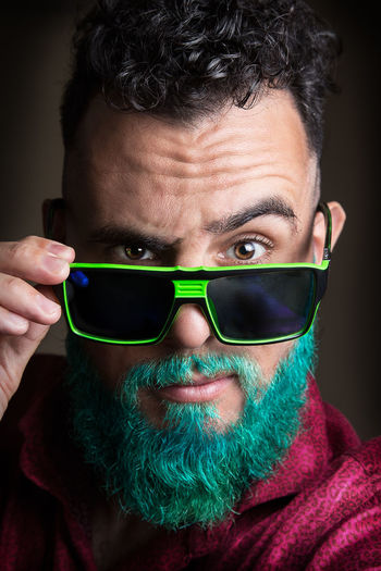 Close-up portrait of bearded man wearing sunglasses