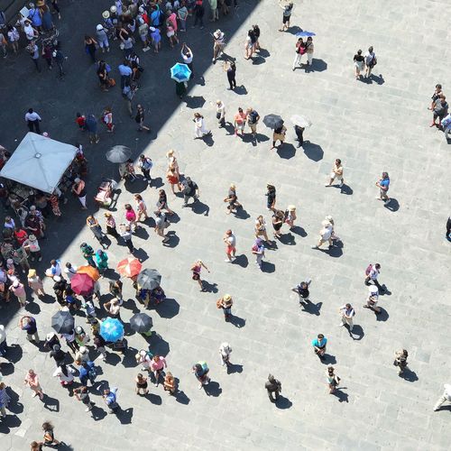 High angle view of people walking on street in florence, italy, piazza della signoria