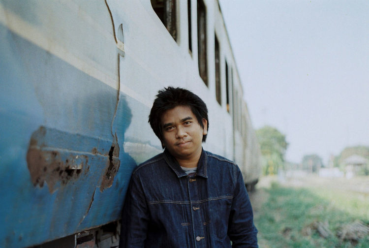 Portrait of young man standing outdoors