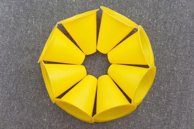 High angle view of yellow umbrella on road