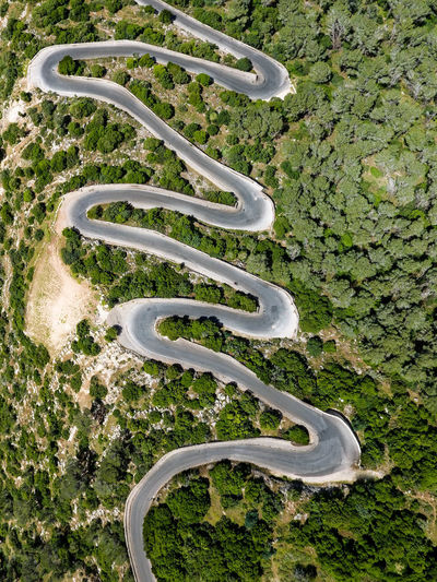 High angle view of road amidst green landscape