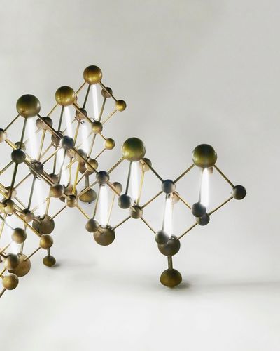 Metallic molecular structure against white background