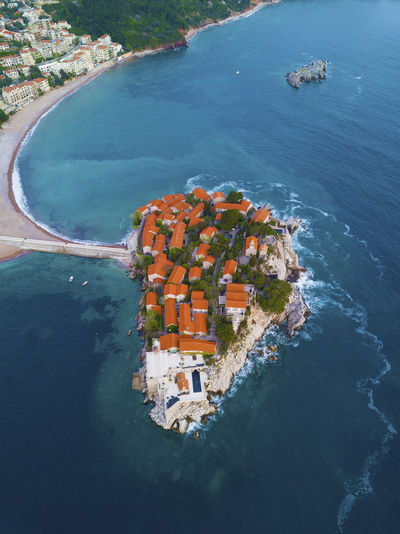 Aerial view of buildings on island in sea