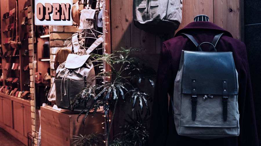 Coat with backpack hanging on wall