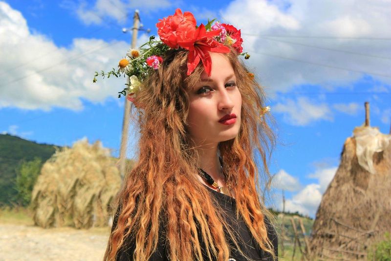 Portrait of beautiful young woman with flower crown