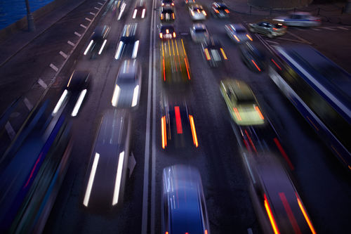 Blurred motion of cars on street at night