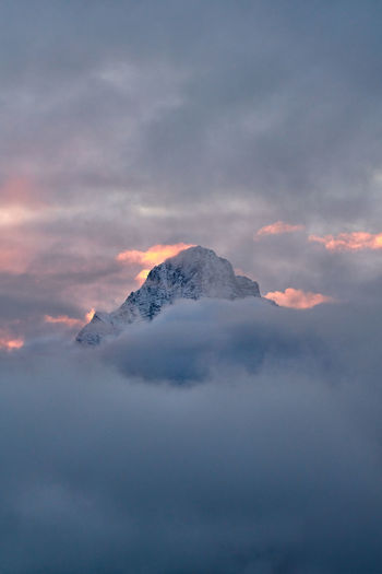 Scenic view of snowcapped mountains against sky during sunset