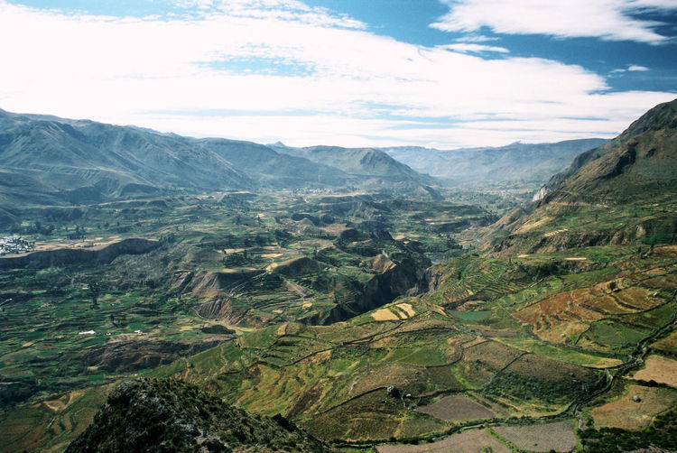 Aerial view of valley against sky