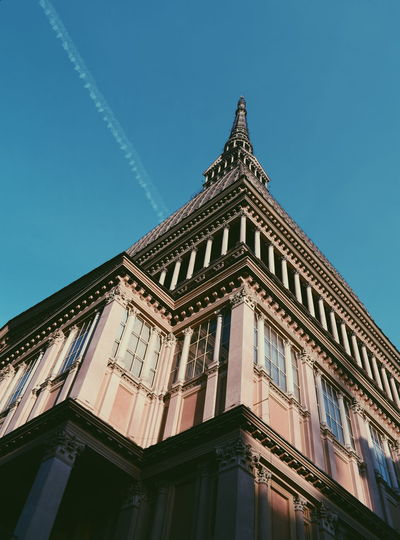 Low angle view of building against blue sky