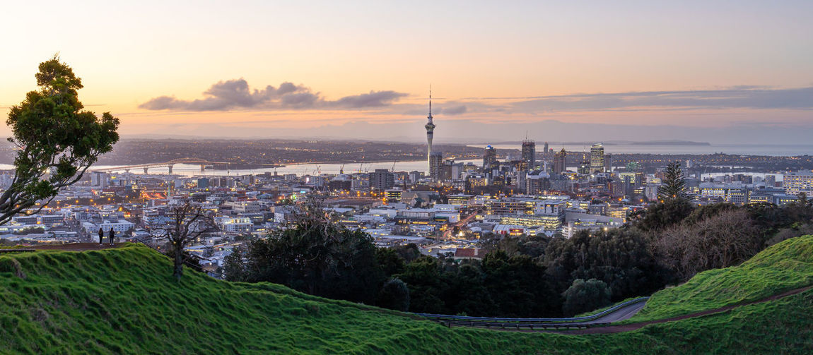 Auckland city skyline with auckland sky tower from mt. eden at sunset new zealand