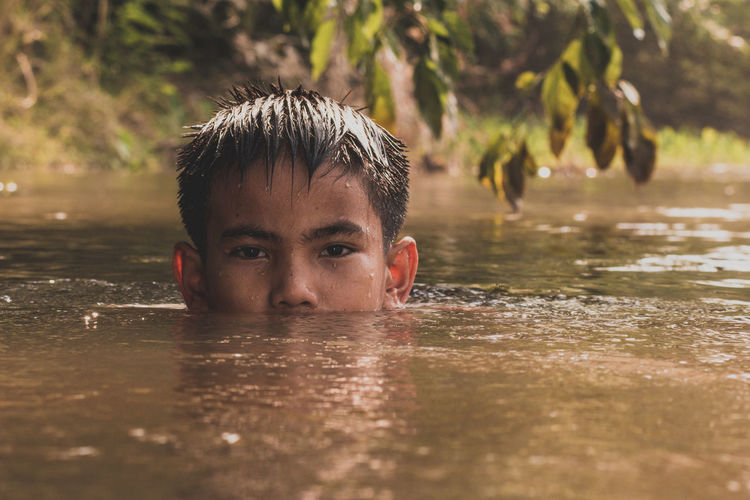 Portrait of a boy in water