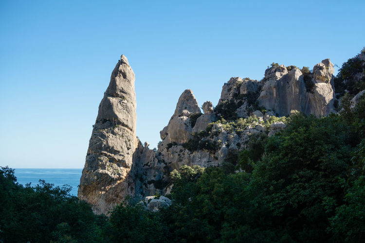 Guglia goloritze, famous for rock climbing, natural icon of cala goloritze in sardinia, italy