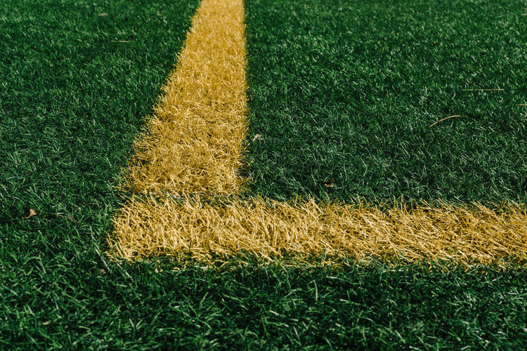 Corner marking on grassy field at court