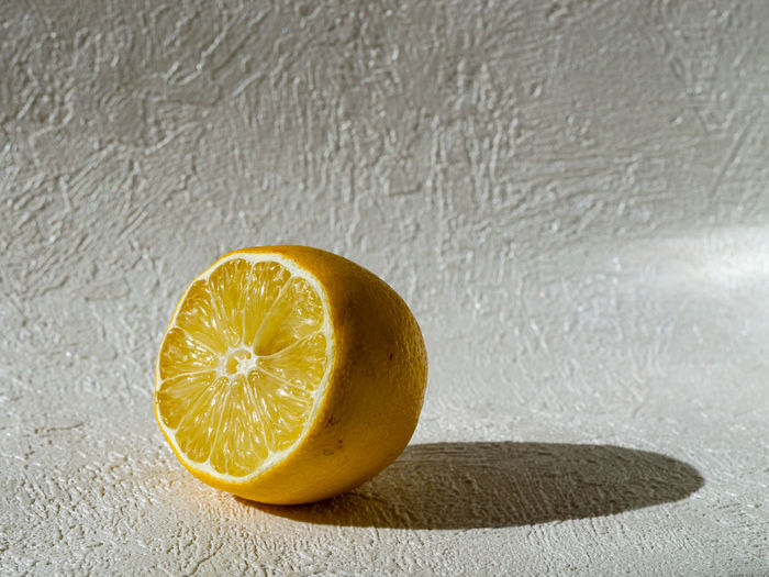 Close-up of lemon slice on table