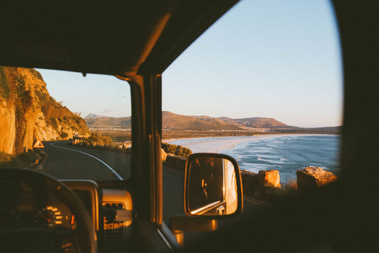 Beauty In Nature Country Road Cropped Journey Land Vehicle Landscape Mode Of Transport Mountain Mountain Range Nature No People Non-urban Scene Part Of Road Scenics Sky Sunset Tranquil Scene Tranquility Transportation Vehicle Interior Windshield Social Media Collection