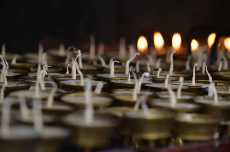 Close-up of votive candles