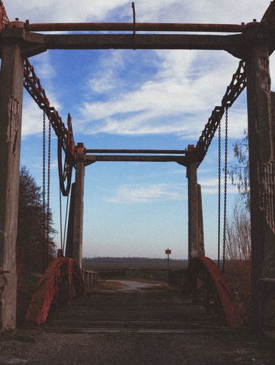 Metal bridge against sky