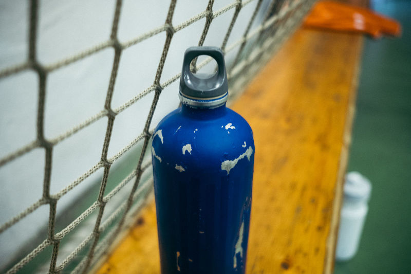 Close-up of bottle on water