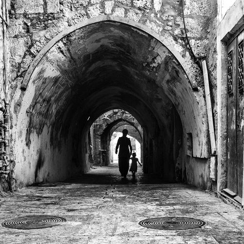 People walking in tunnel
