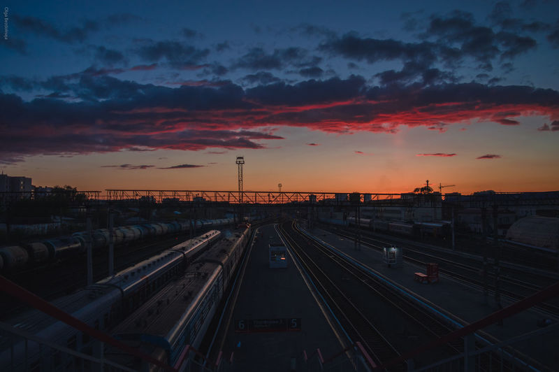 High angle view of railroad tracks against cloudy sky