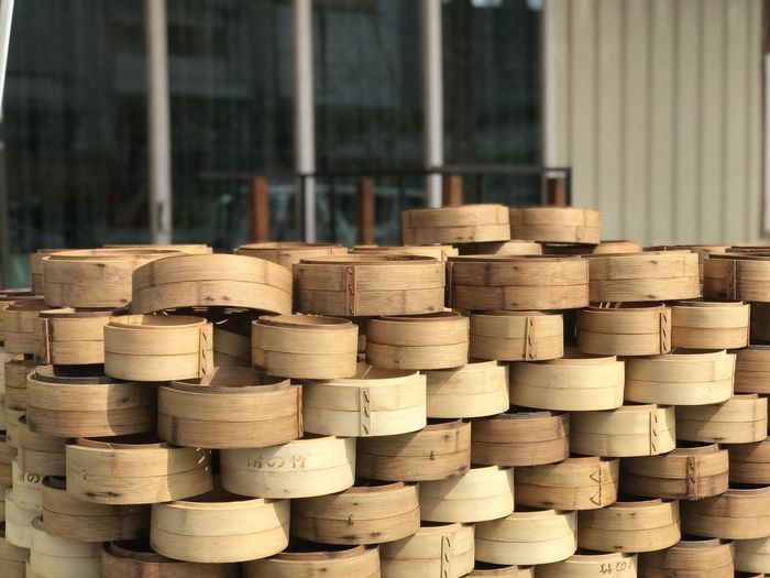 Stack of bamboo steamer in building